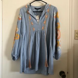 Blue gingham dress with embroidery